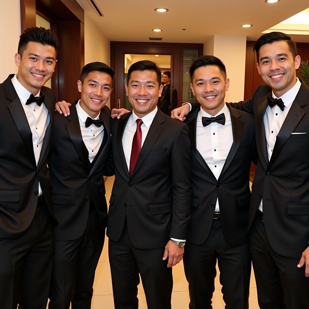 Bùi Tiến Dũng posing with fellow footballers at his wedding