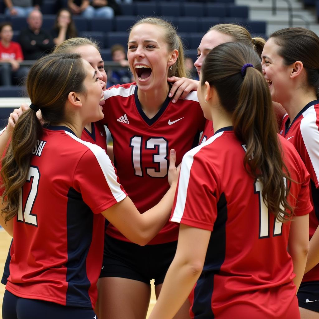 Volleyball team celebrating a point