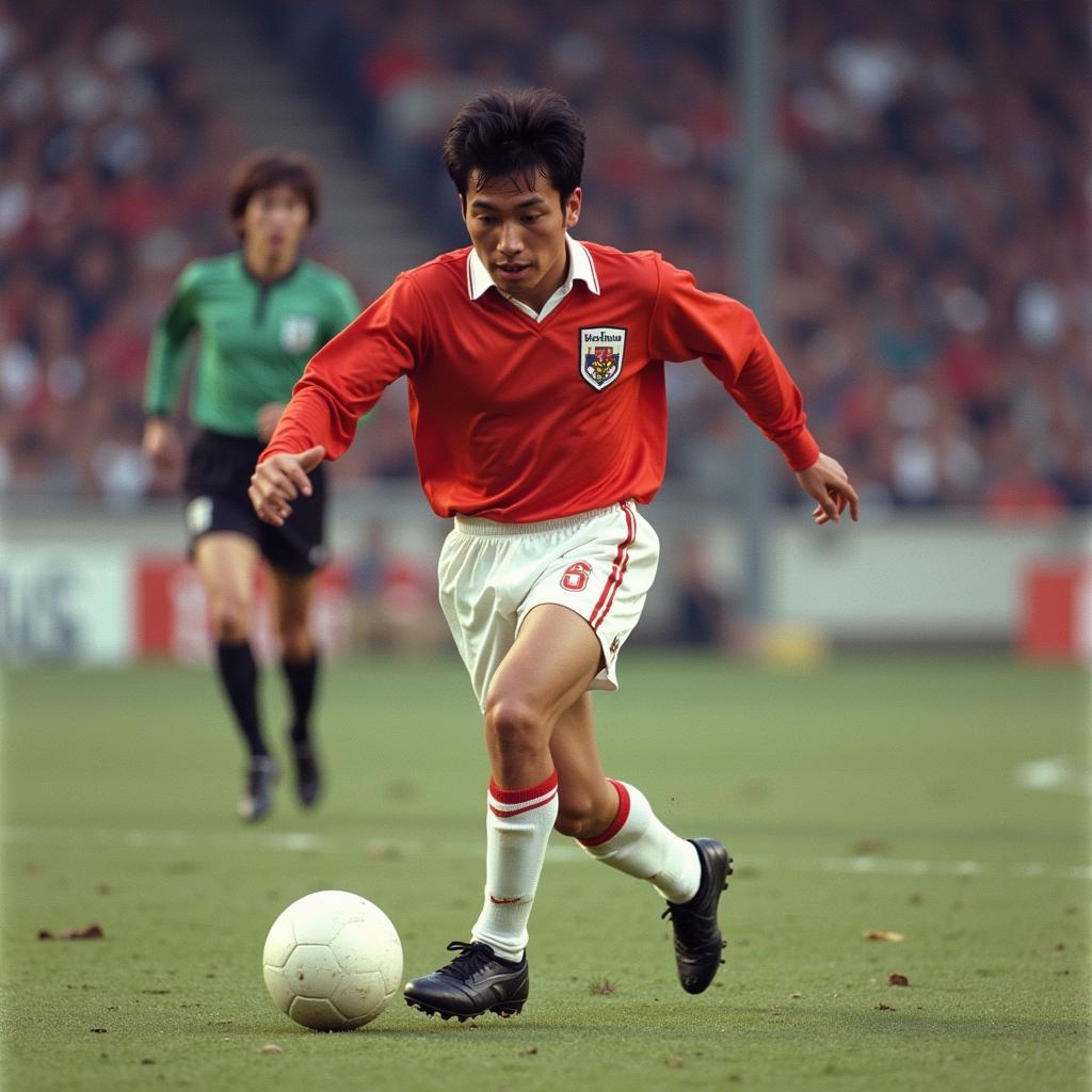 Cha Bum-kun dribbles past a defender while playing for Eintracht Frankfurt