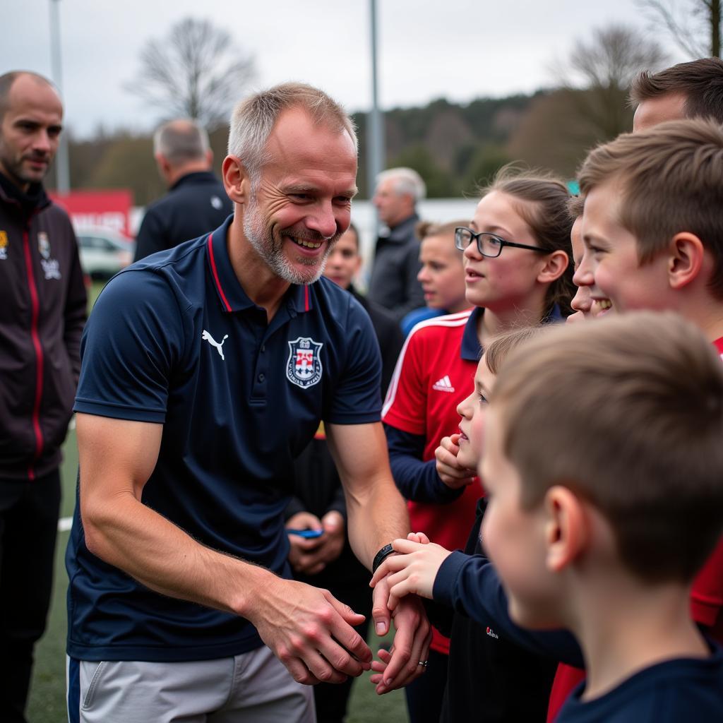 Erling Haaland interacting with young fans