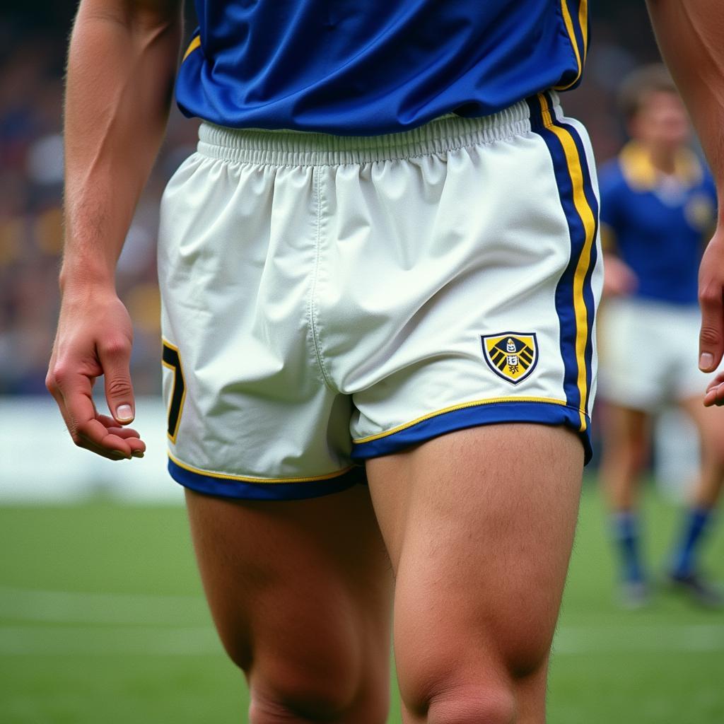 Erling Haaland sporting the classic Leeds United home kit, featuring the iconic white shorts with blue and yellow trim.