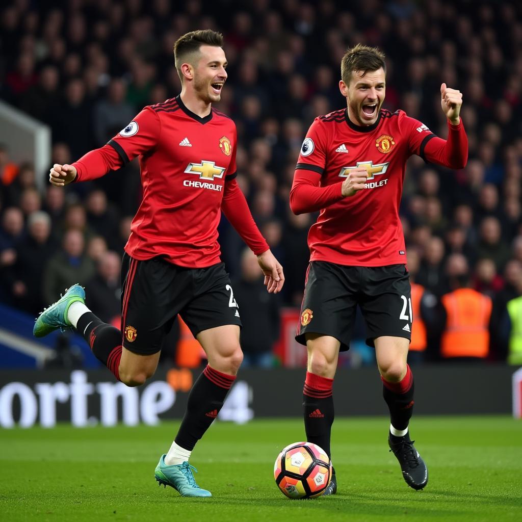 Foden and Haaland celebrating a hat trick against Manchester United