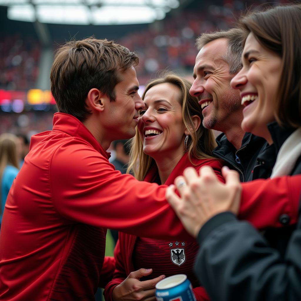 German football players interacting with fans