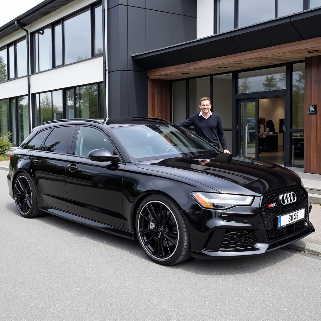 Erling Haaland Standing Next to his Audi RS6 Avant