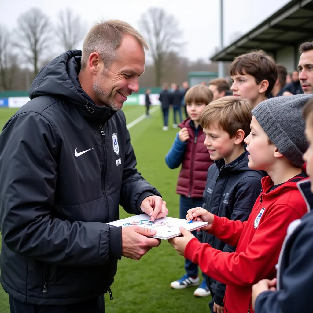 Haaland signing autographs for young Bochum fans