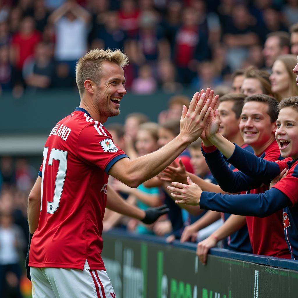 Erling Haaland celebrates a goal with fans