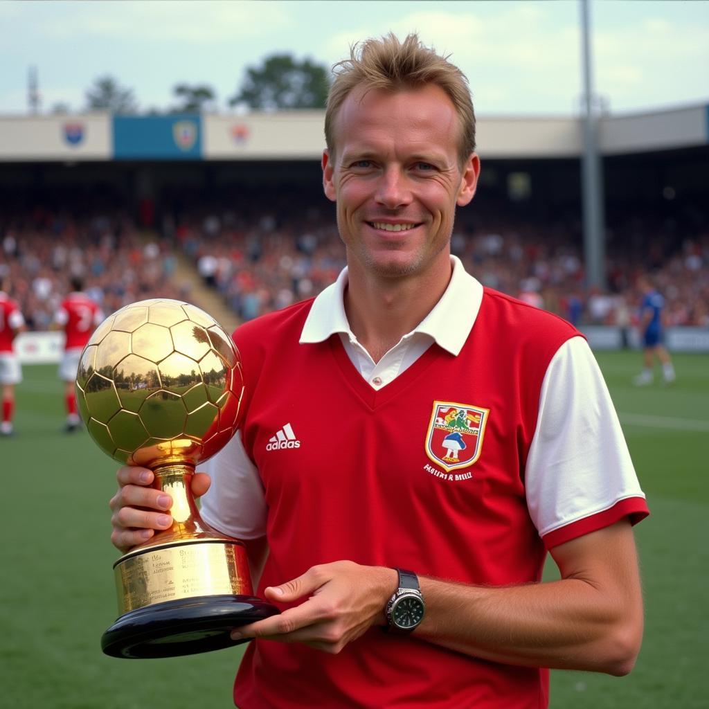 Haaland posing with a Golden Boot trophy