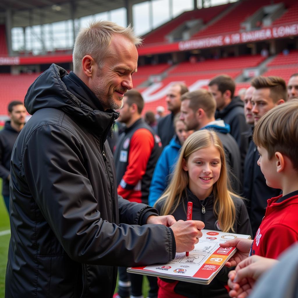 Haaland signs autographs for fans in Köln