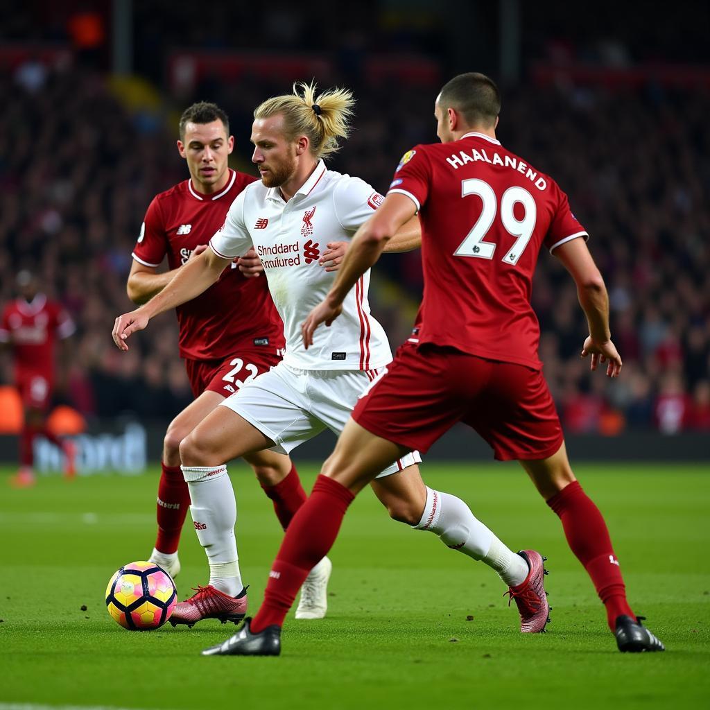 Haaland battling for possession against Liverpool's defense