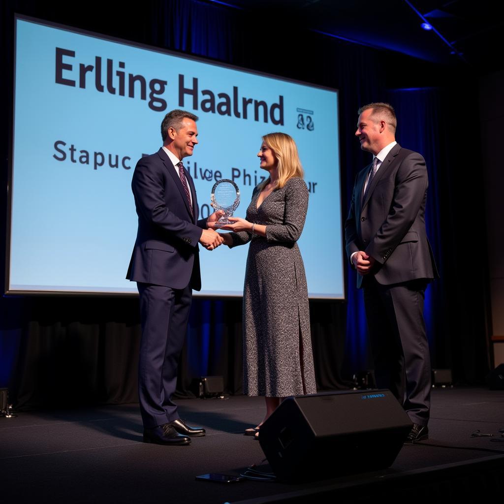 Erling Haaland receiving the Player of the Year award