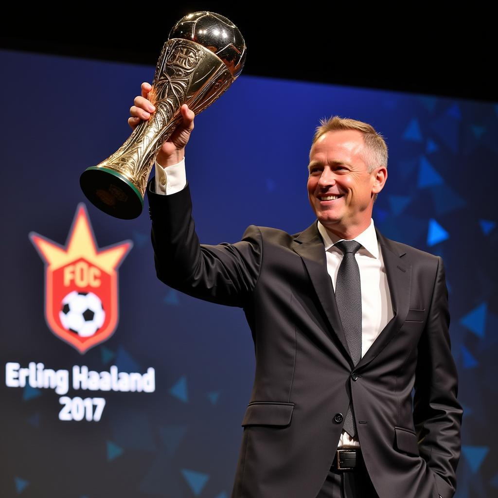 Erling Haaland receives a football award