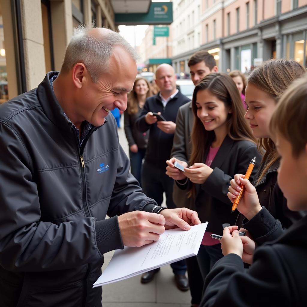 Haaland signing autographs for young fans