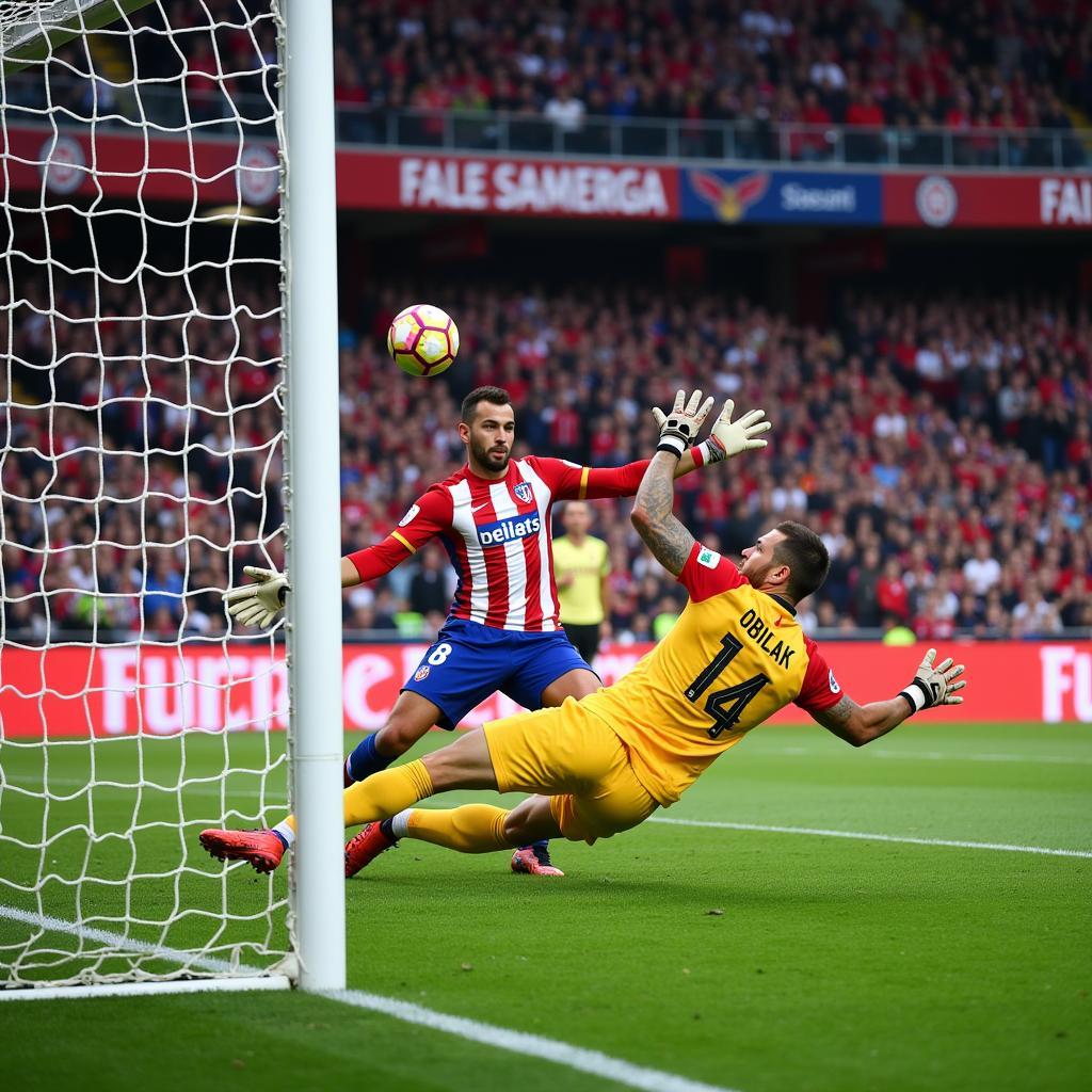 Jan Oblak makes a diving save for Atletico Madrid