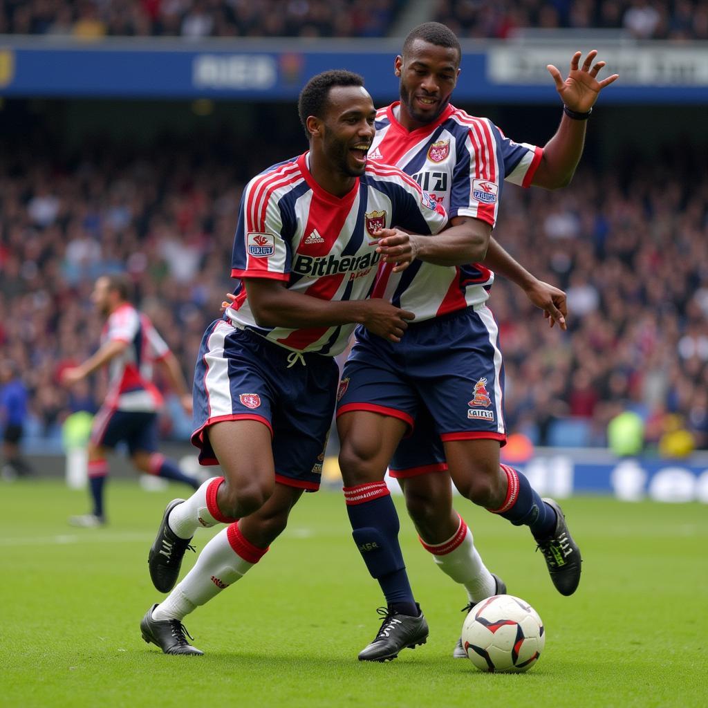 Jay-Jay Okocha celebrates a goal with teammates