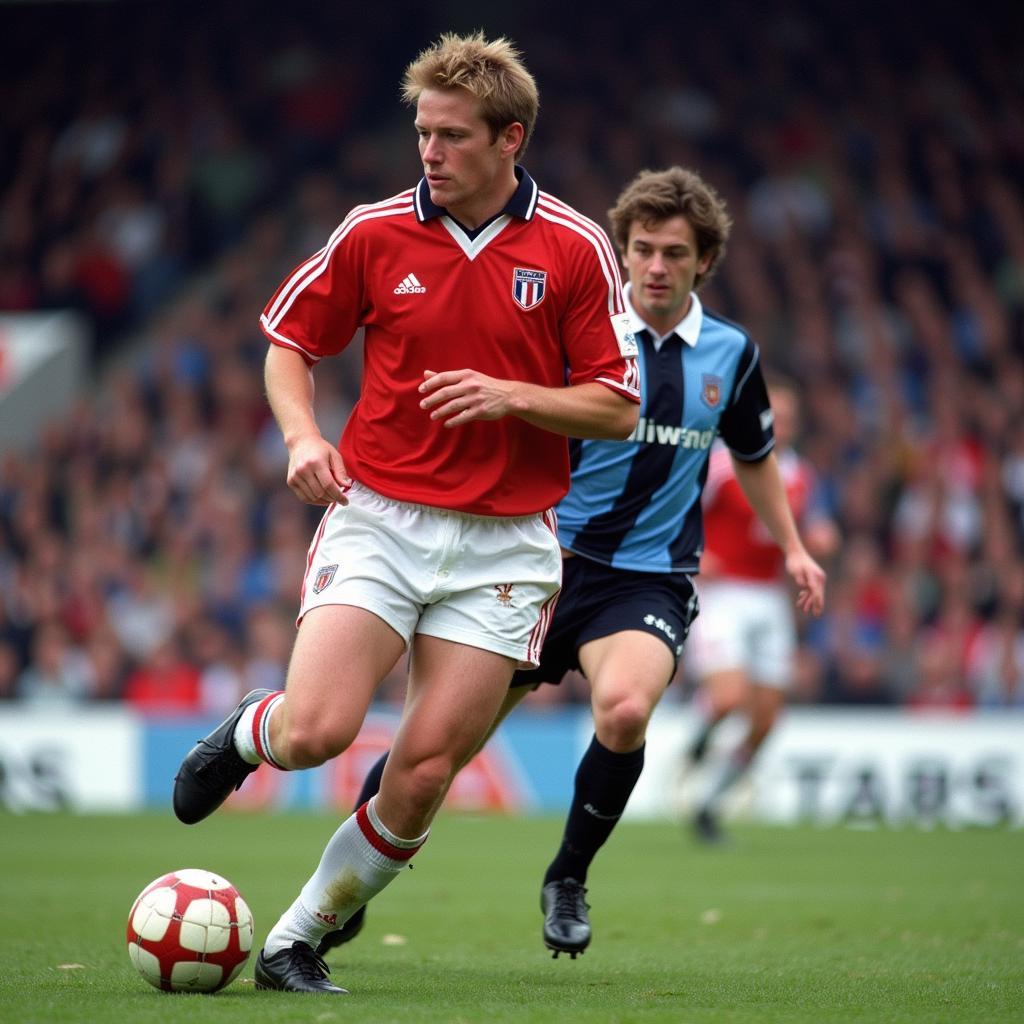 Kevin Gallacher dribbling the ball during a match for Blackburn Rovers