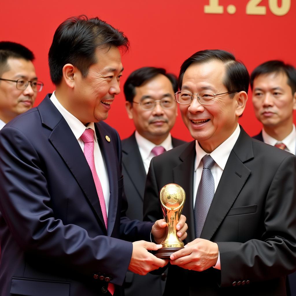 Nguyen Anh Duc receiving an award for his contributions to Vietnamese football.