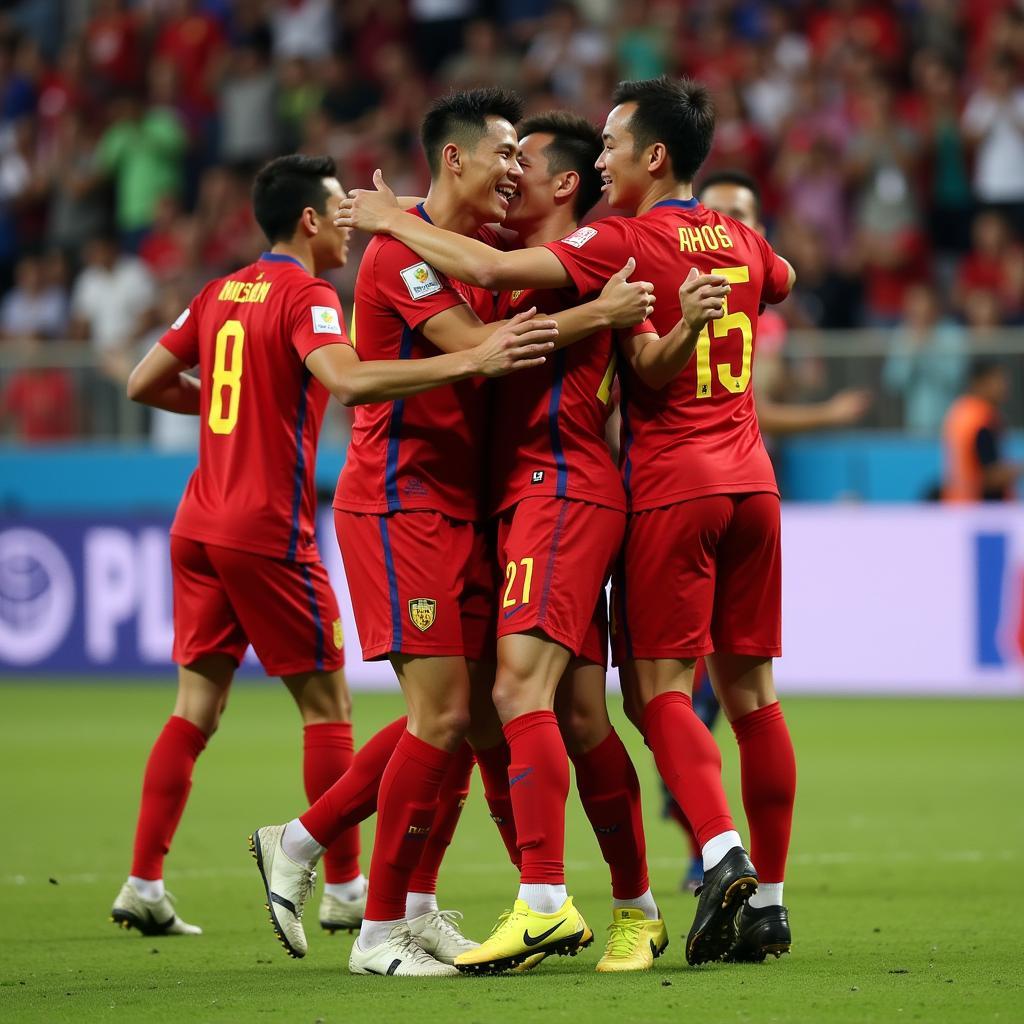 Nguyen Viet Phong celebrating a goal with teammates