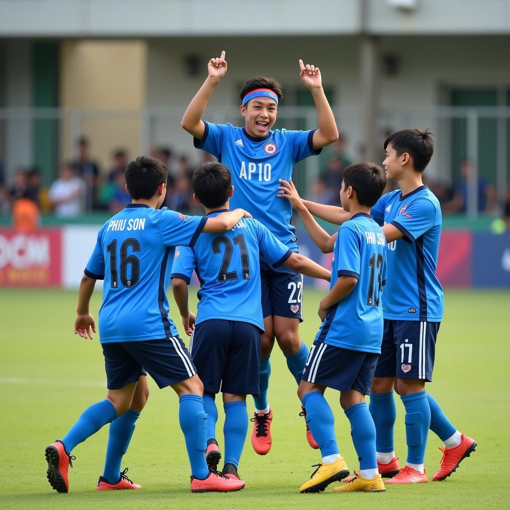 Tran Phu Son celebrating a goal with his teammates