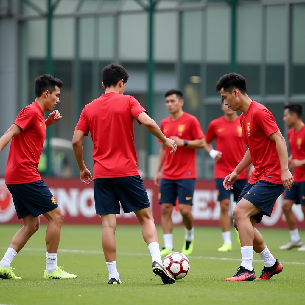 U23 Vietnam players practicing drills with intense focus