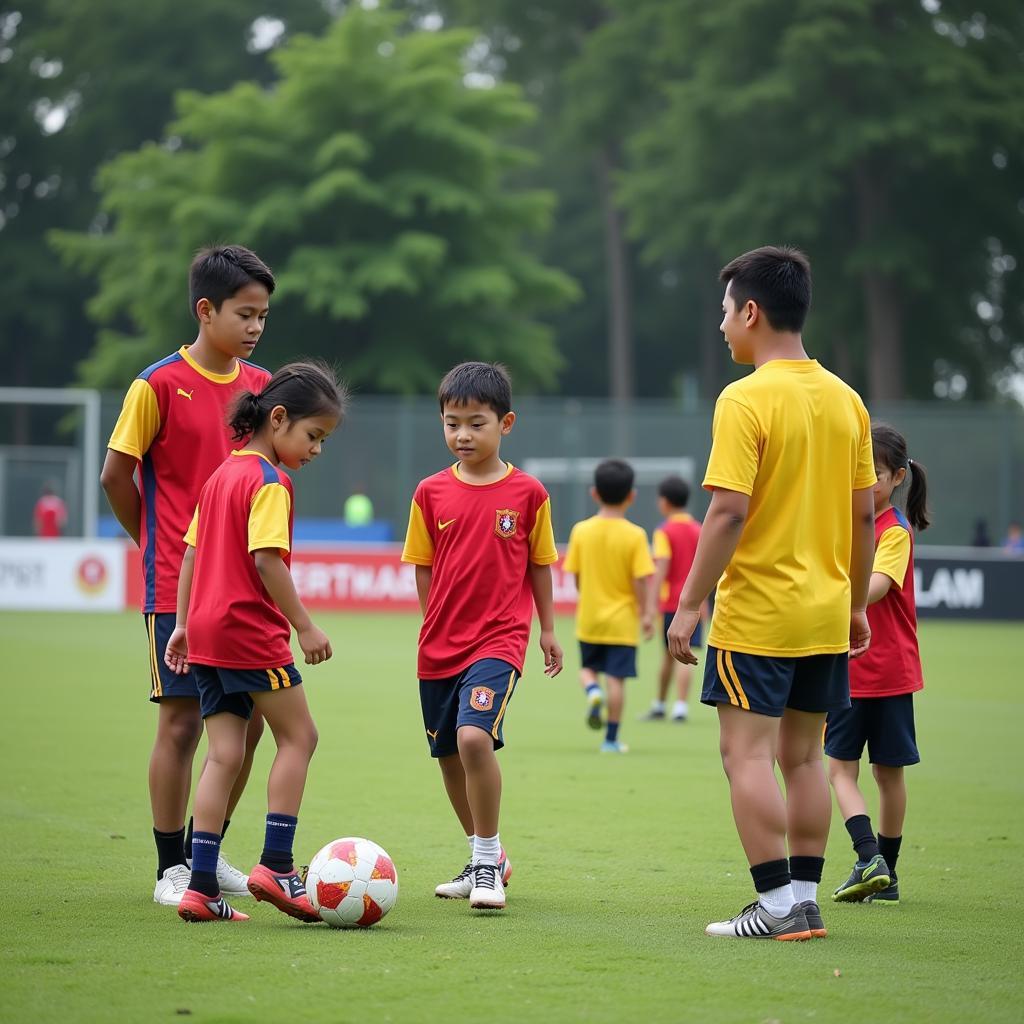 Young aspiring footballers training at a Malaysian academy