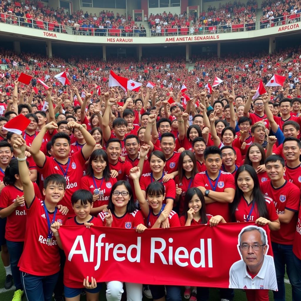 Fans celebrating Alfred Riedl’s success in Southeast Asia.