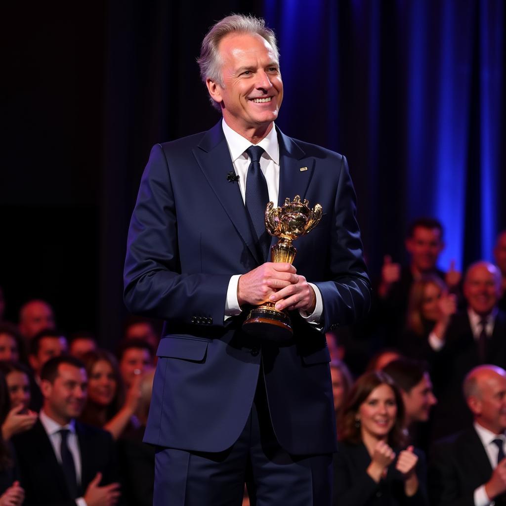 Erling Haaland accepting an award in a dark blue suit.