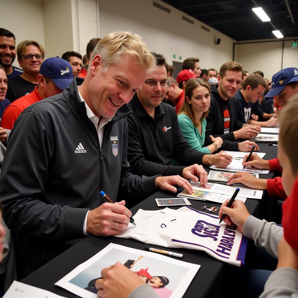 Erling Haaland signing autographs for fans after a match.