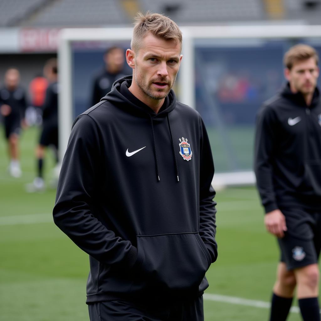 Erling Haaland training in a black hoodie