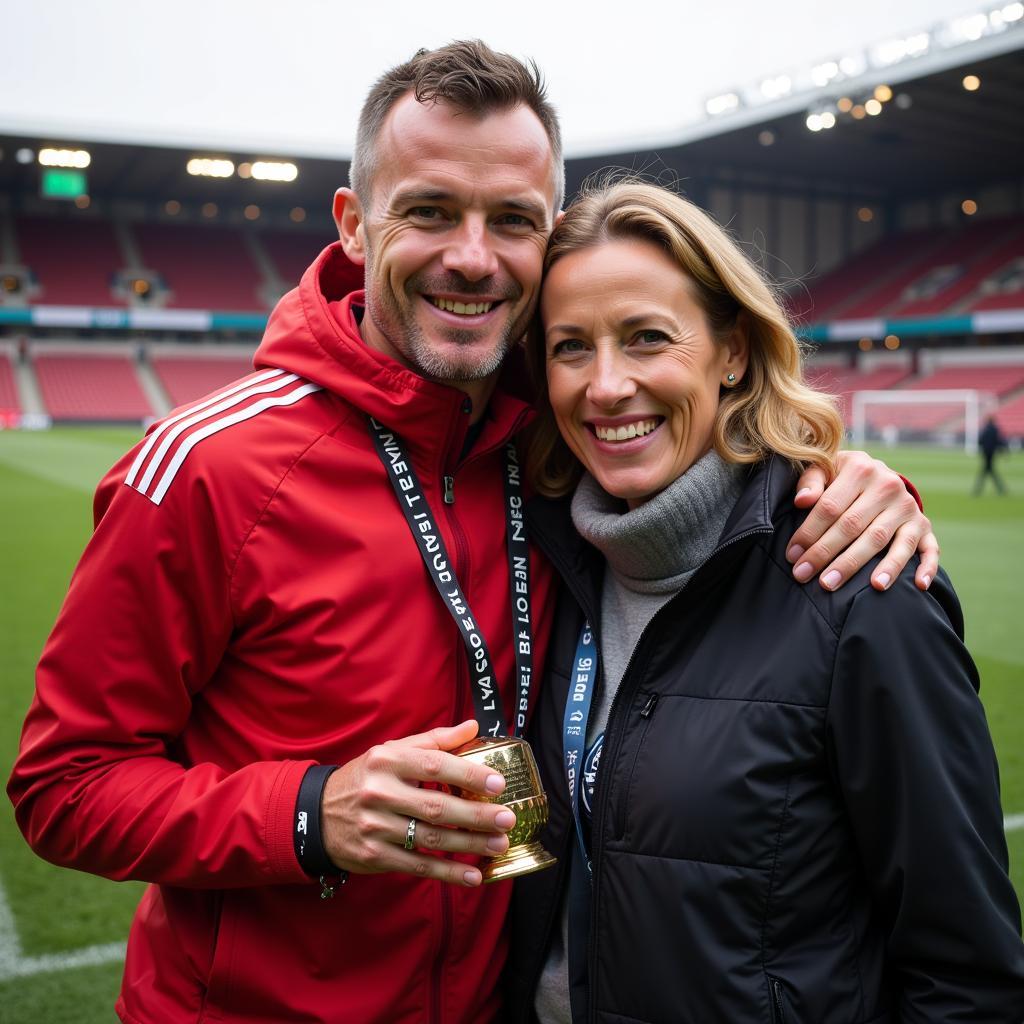 Erling Haaland and Gry Marita Braut celebrating a significant football victory