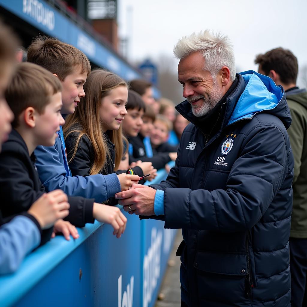 Haaland interacts with fans at the Etihad