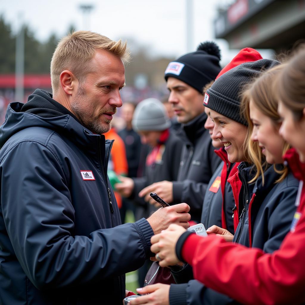 Haaland interacts with fans after a match