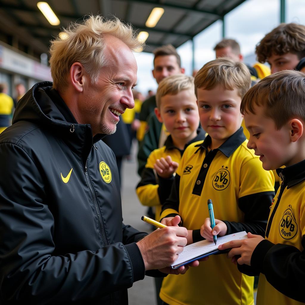 Erling Haaland interacting with Dortmund fans