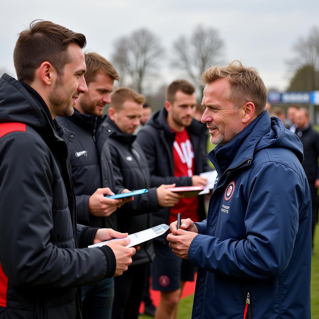 Erling Haaland interacts with fans after a match.