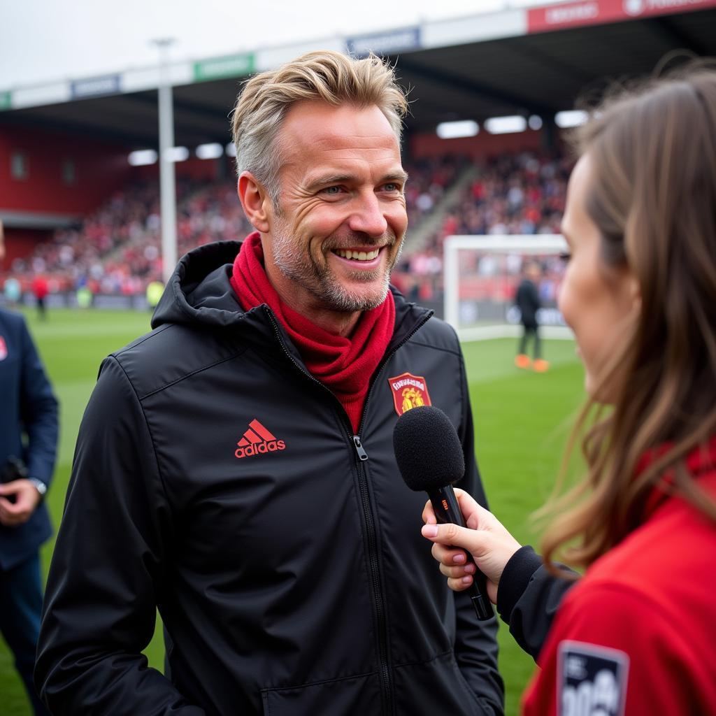 Haaland gives a post-match interview after the Köln game