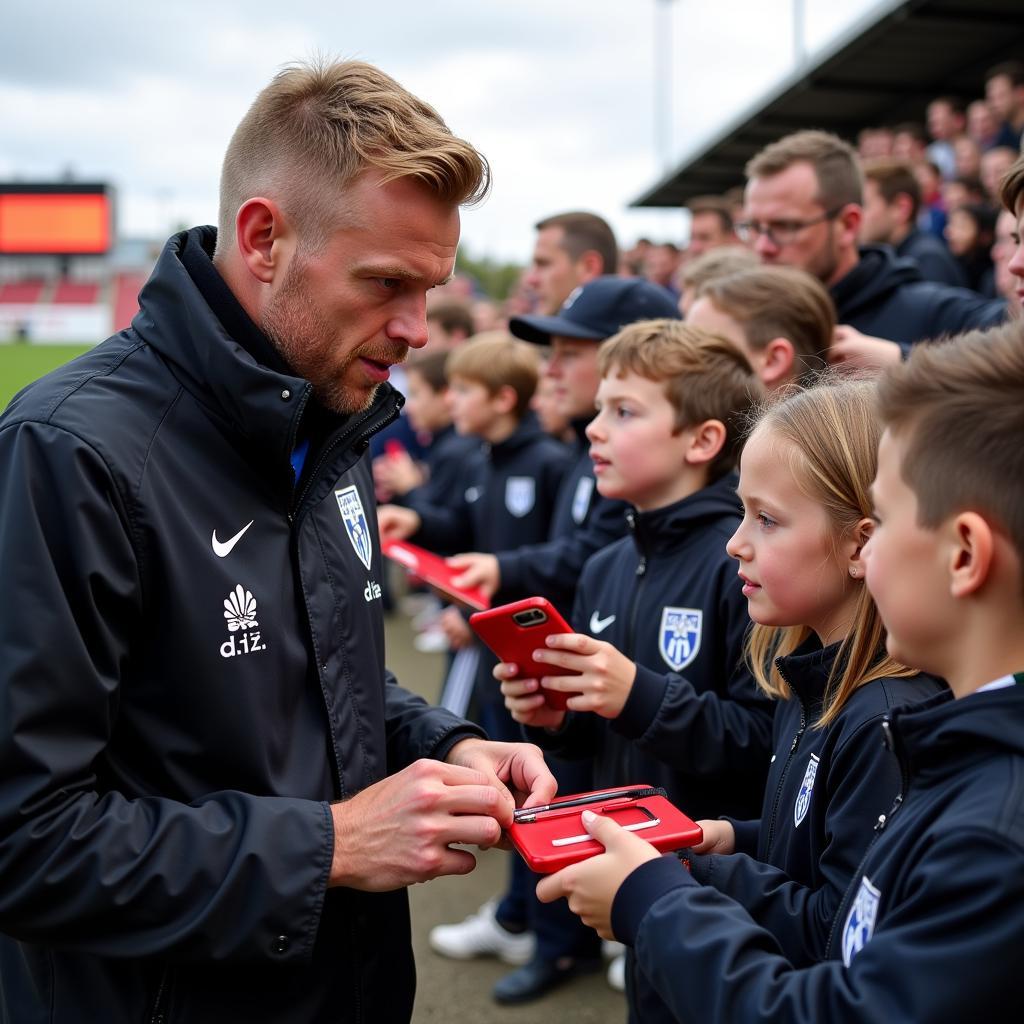 Erling Haaland interacts with young fans after a match