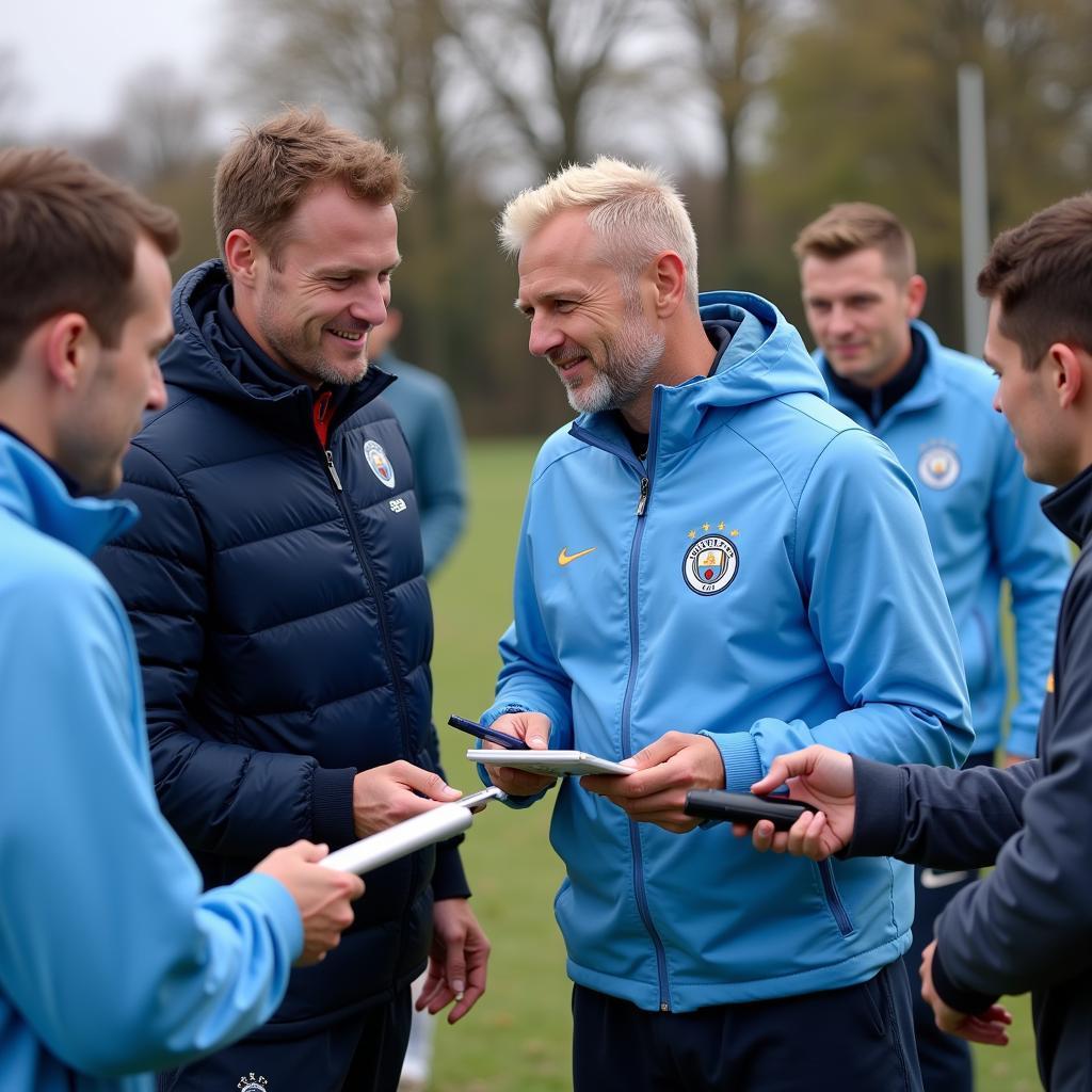 Erling Haaland signs autographs for Manchester City fans.