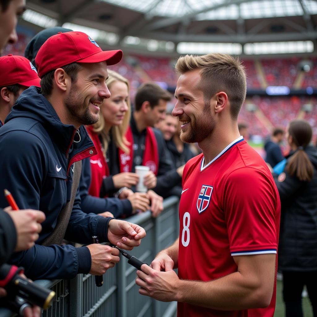 Haaland signs autographs for fans while wearing the Norway national team jersey