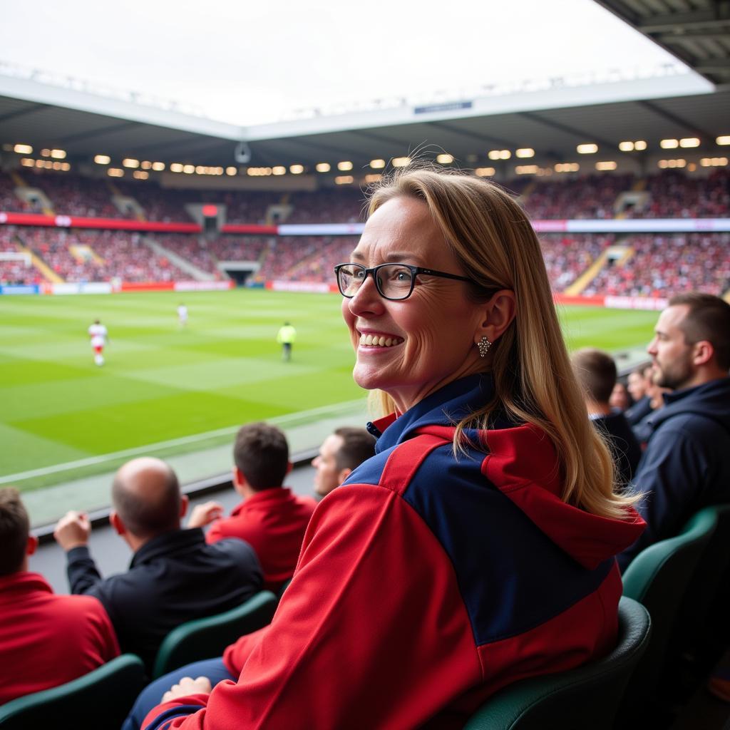 Hanne Haaland supporting Erling Haaland at a football match