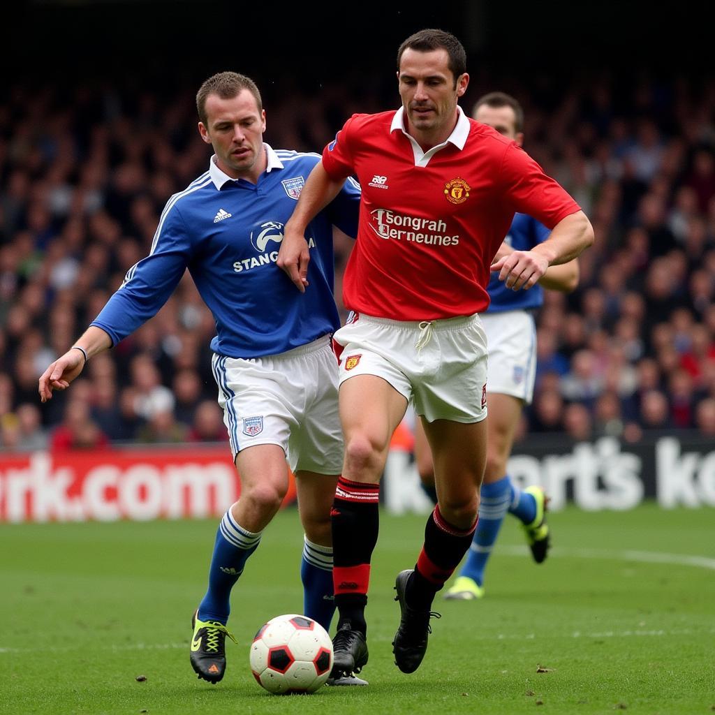 Keane tackling Haaland in the Manchester Derby