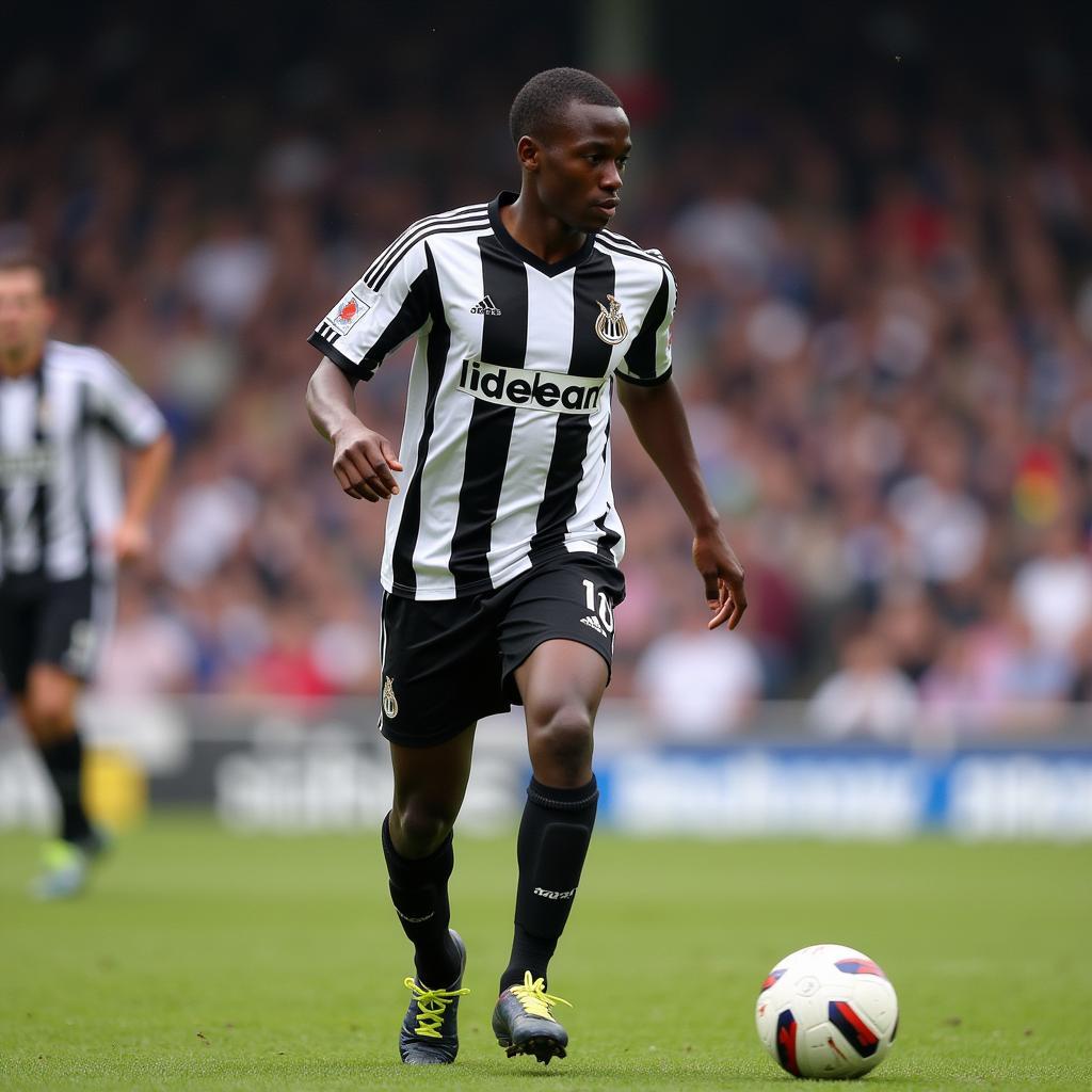 Louis Saha in a Newcastle United kit