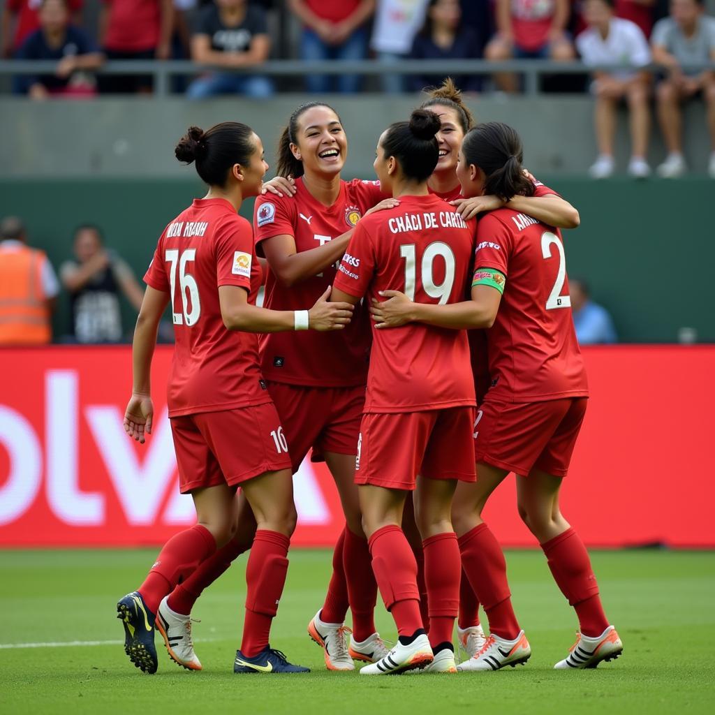 Ngoc Tram celebrating a goal with her teammates