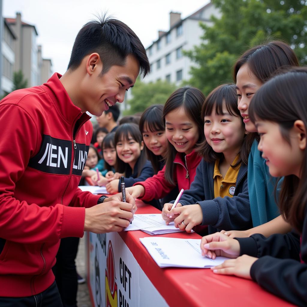 Tien Linh signing autographs for fans in Hai Lang