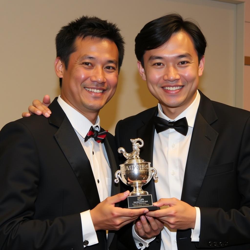 Tuan Hai receiving an award for his performance