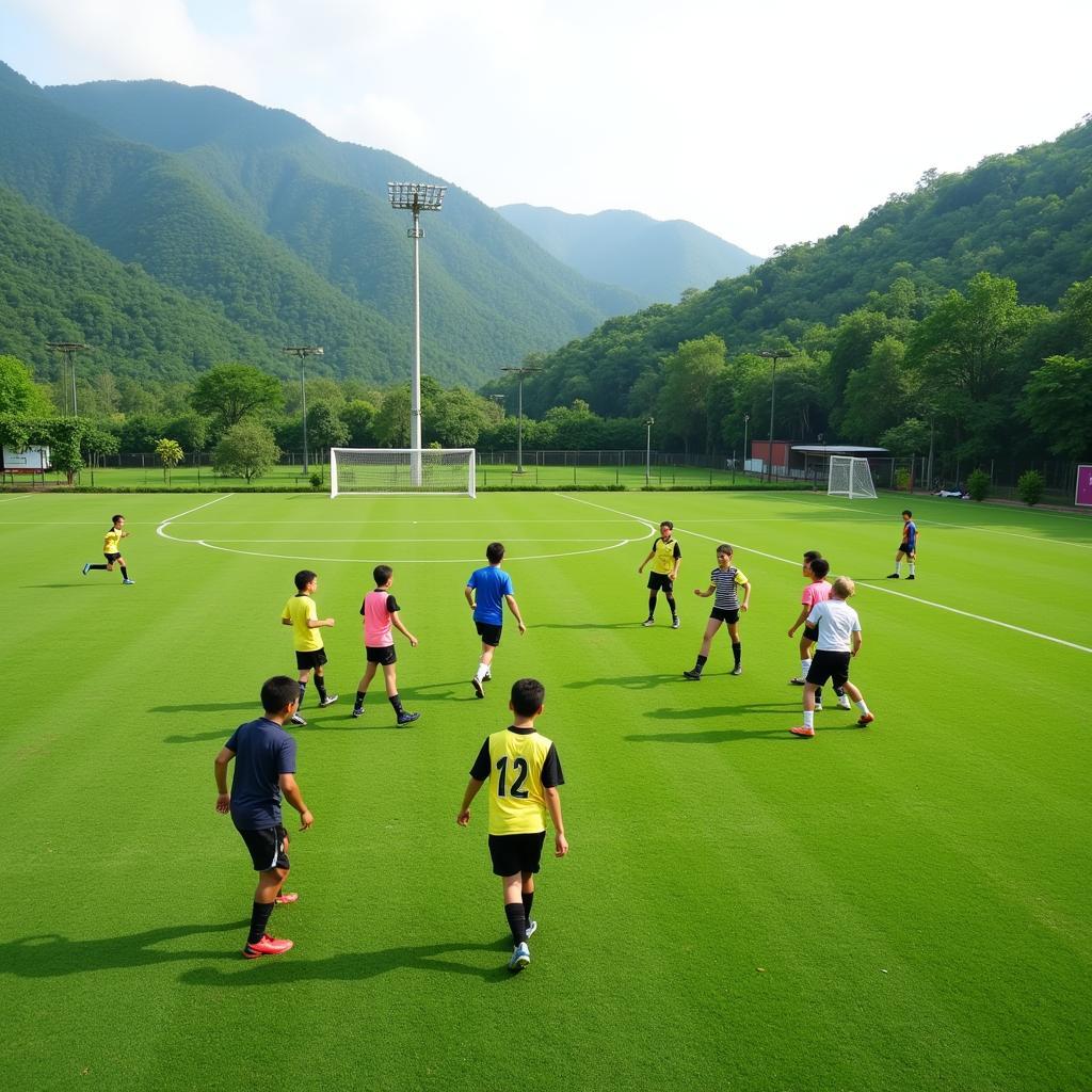 Tuyen Quang Football Field - Youth players training on a vibrant green field in Tuyen Quang Province