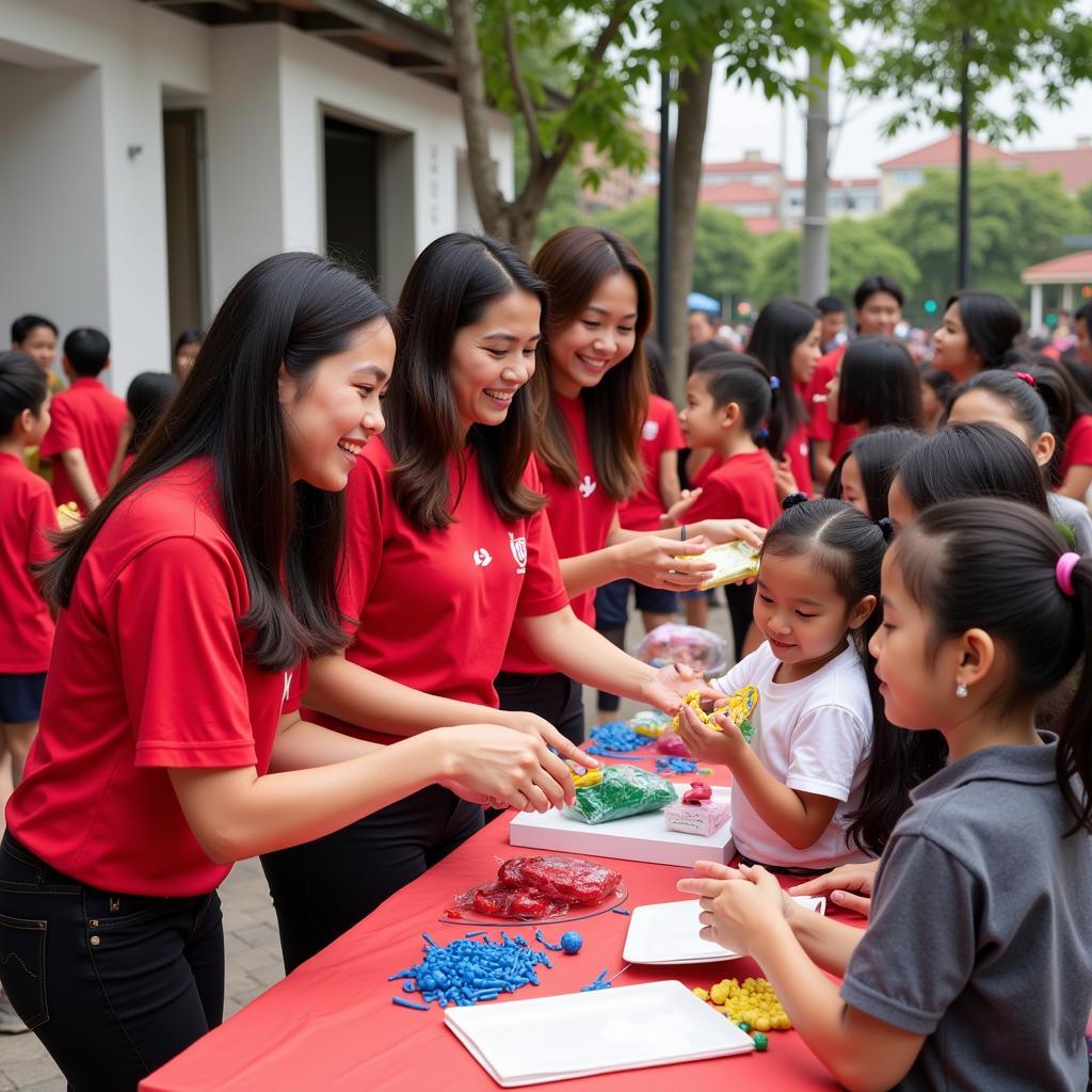 Wives of Vietnamese football players participating in a community outreach program.