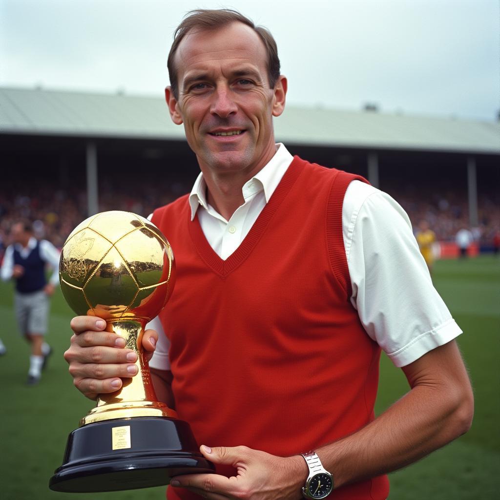 Bobby Charlton holding the Ballon d'Or trophy in 1966