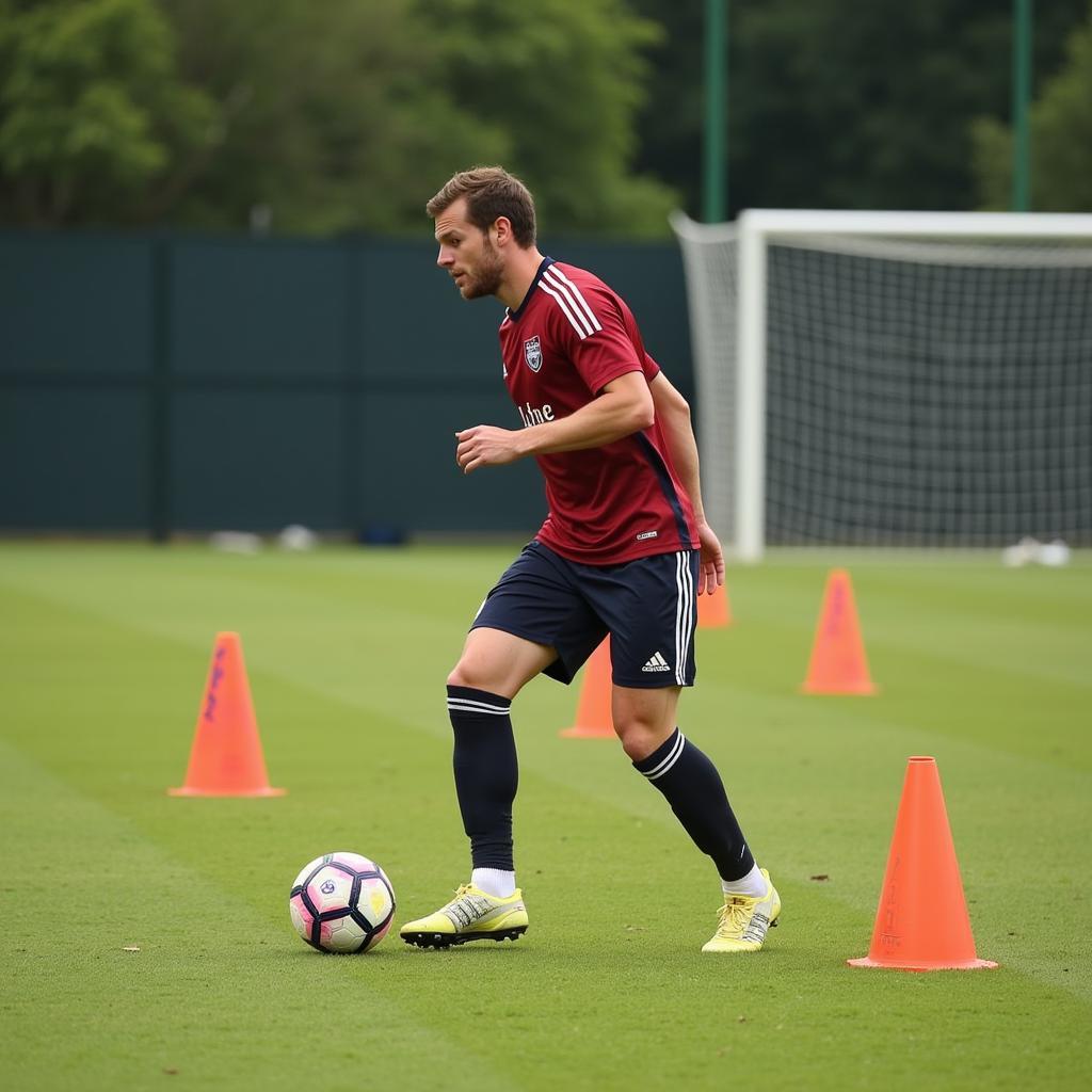 Football player practicing dribbling drills