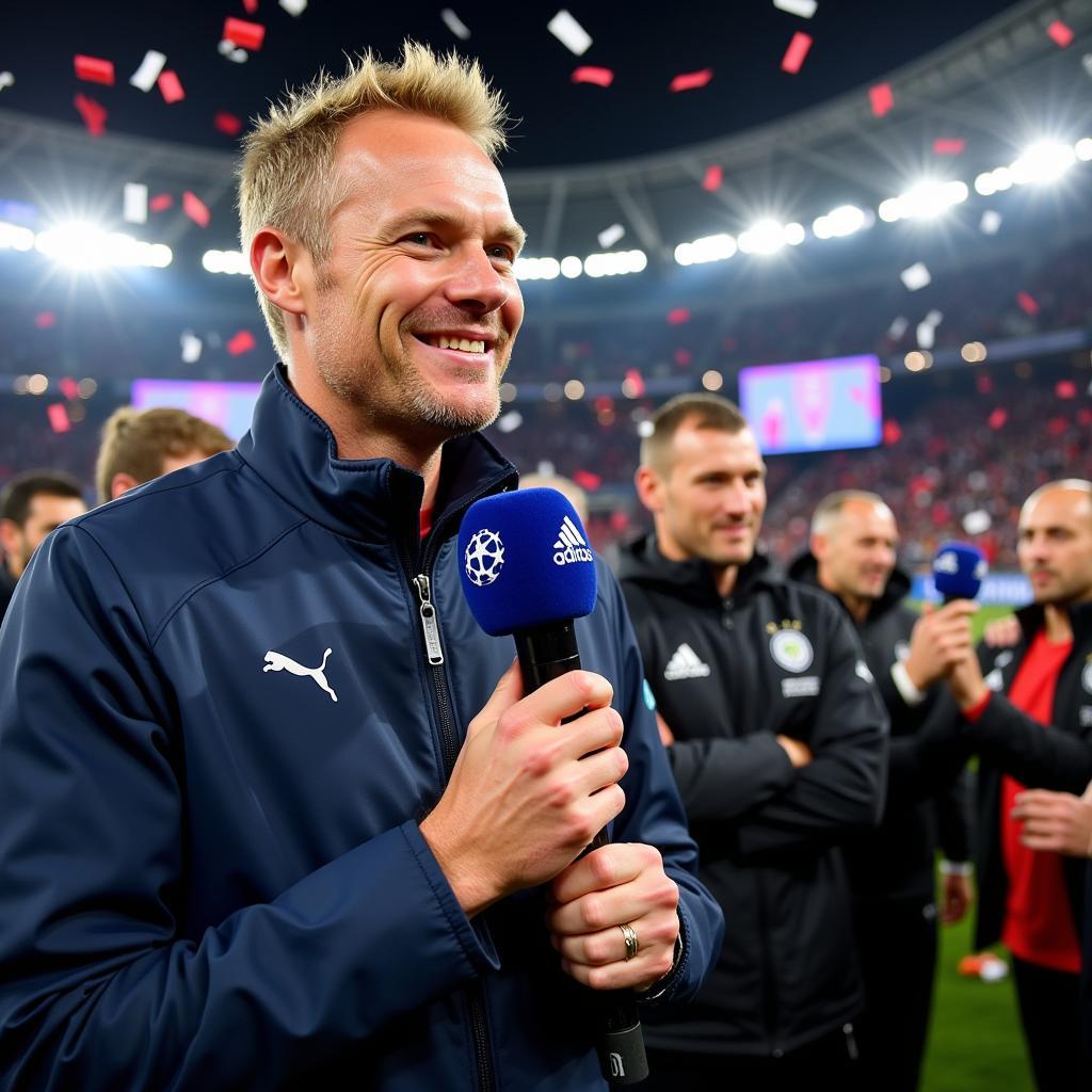 Haaland celebrating after a Champions League match, being interviewed on the pitch.