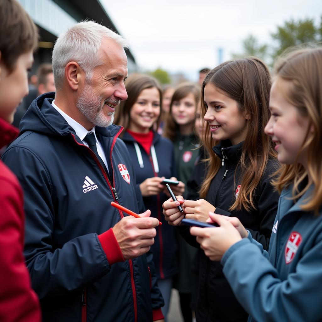 Erling Haaland interacting with young football fans