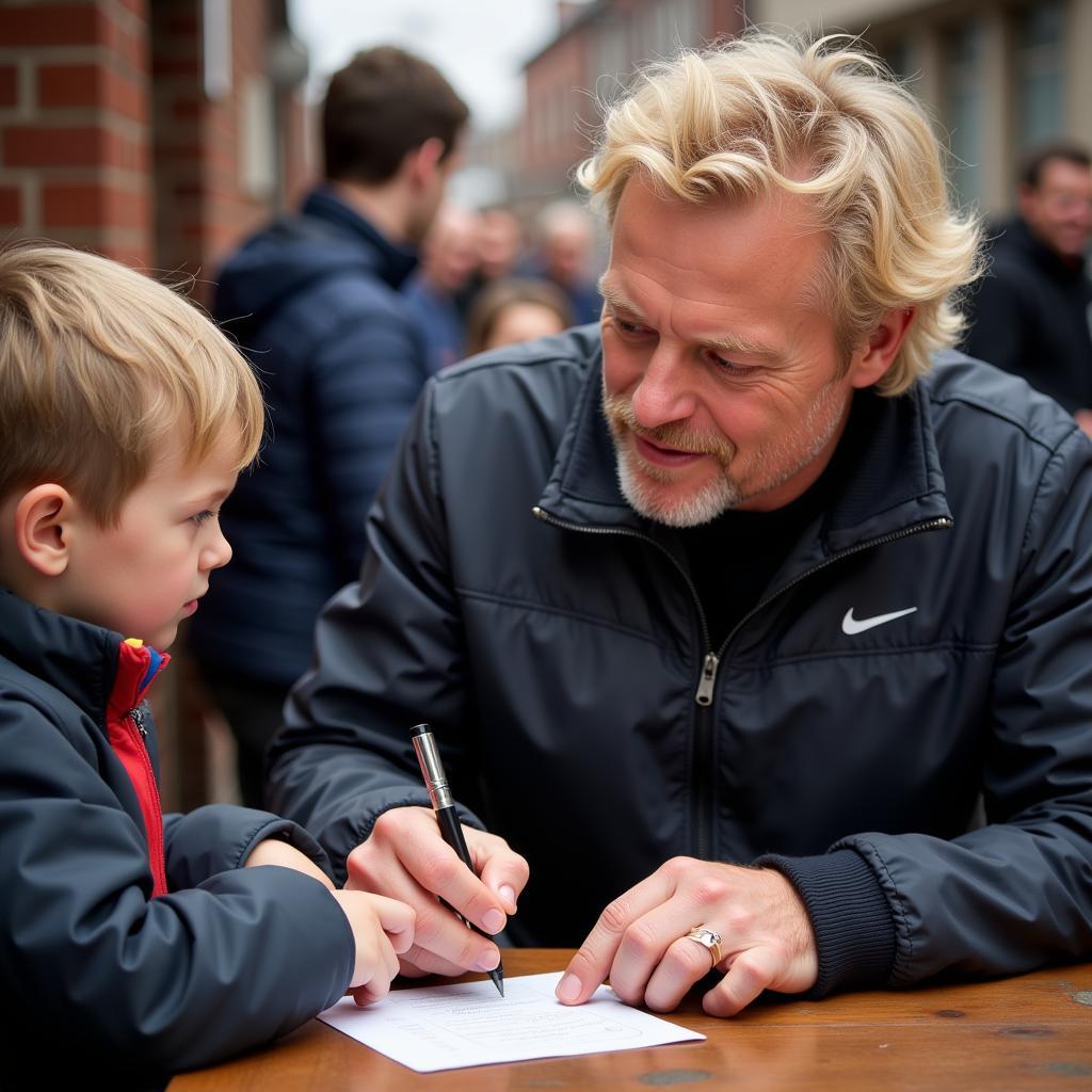 Erling Haaland Signing an Autograph for a Young Fan